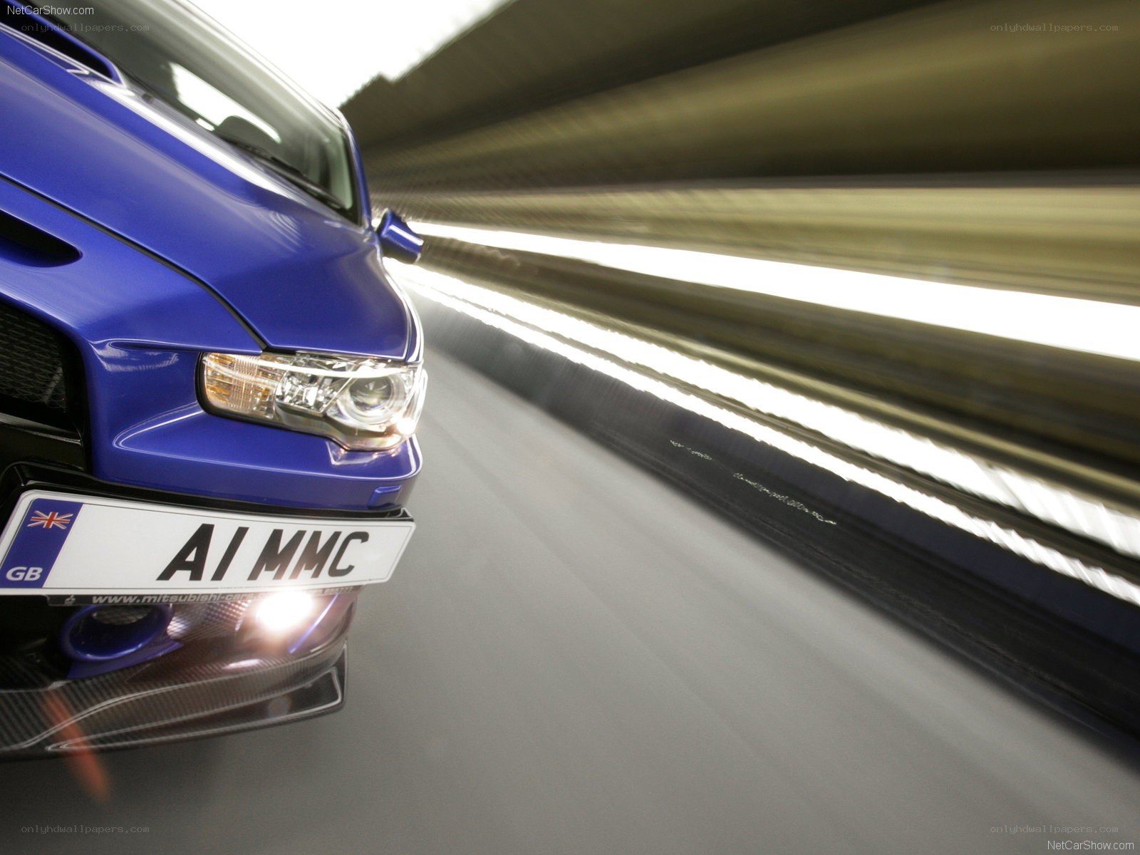 blue mitsubishi in motion
