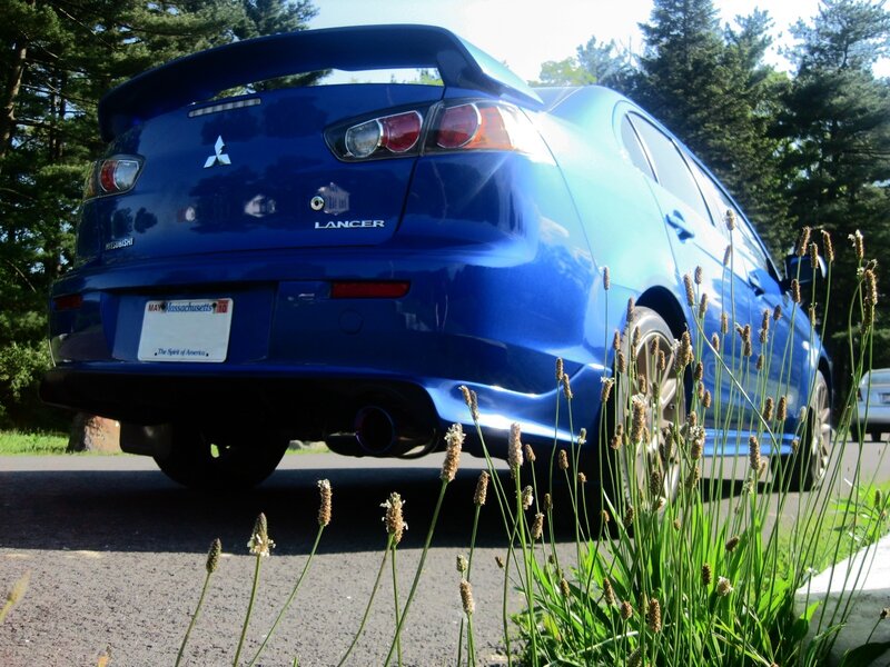 Blue Mitsubishi Lancer — Calm, Afternoon, Photograph, Car, Plants