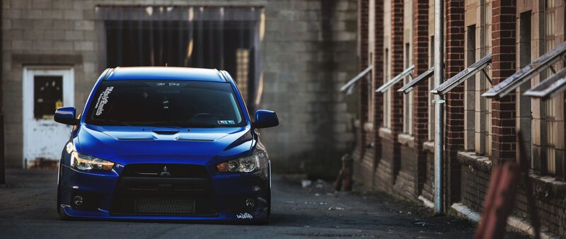 Blue Mitsubishi Lancer — Dramatic, Afternoon, Photograph