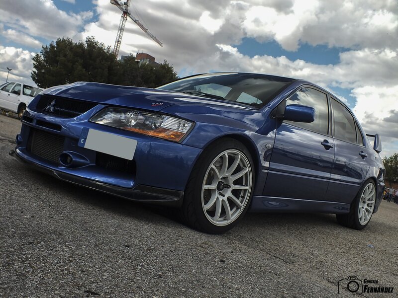 Blue Mitsubishi Lancer — Dramatic, Afternoon