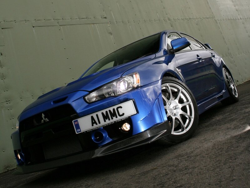 Blue Mitsubishi Lancer — Dramatic, Photograph, Car, Wall, License Plate, Black, Silver