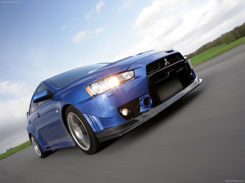 blue mitsubishi lancer evolution on track
