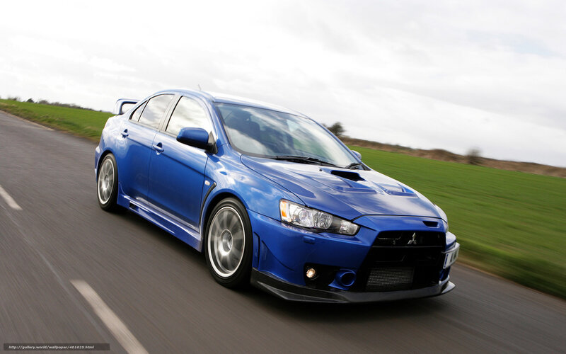blue mitsubishi lancer in motion