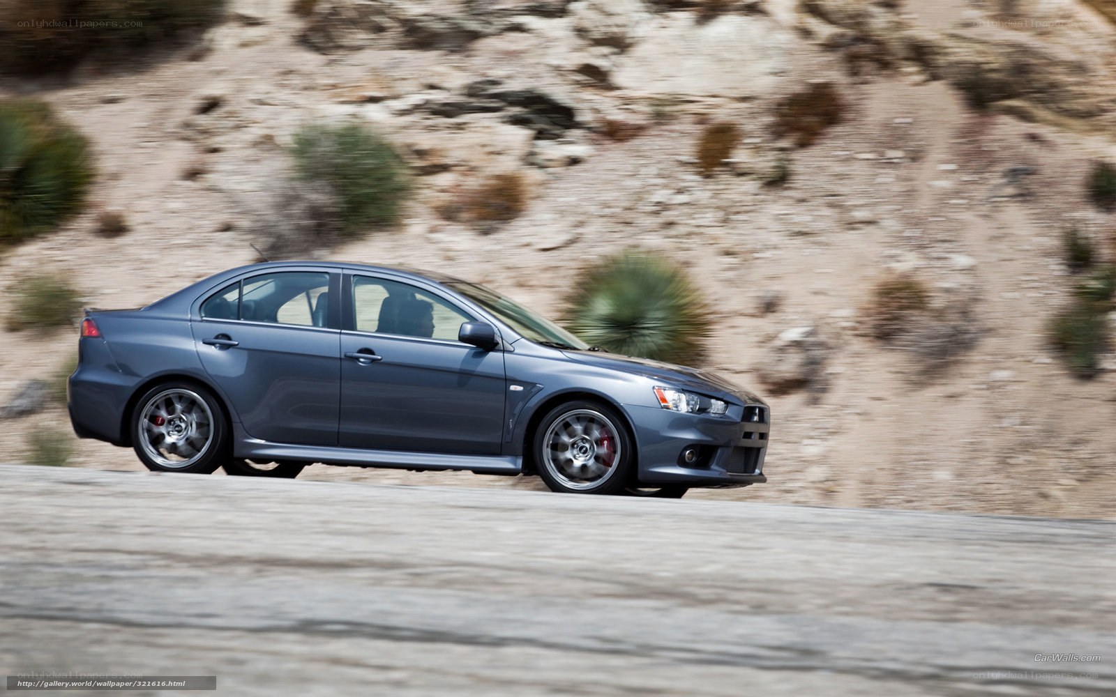 blue mitsubishi lancer in motion