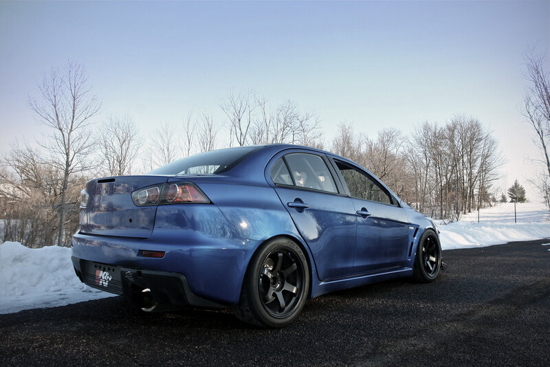 blue mitsubishi lancer in winter