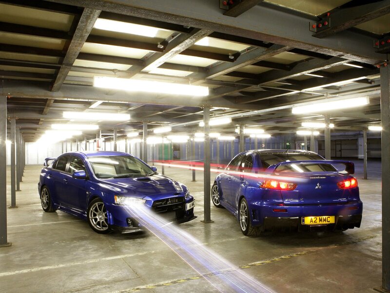 Blue Mitsubishi Lancers in Garage