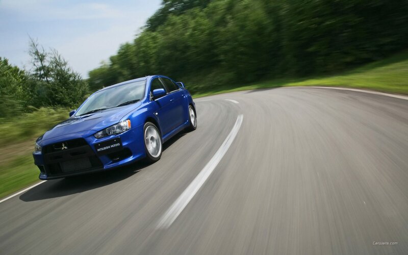 blue mitsubishi on winding road