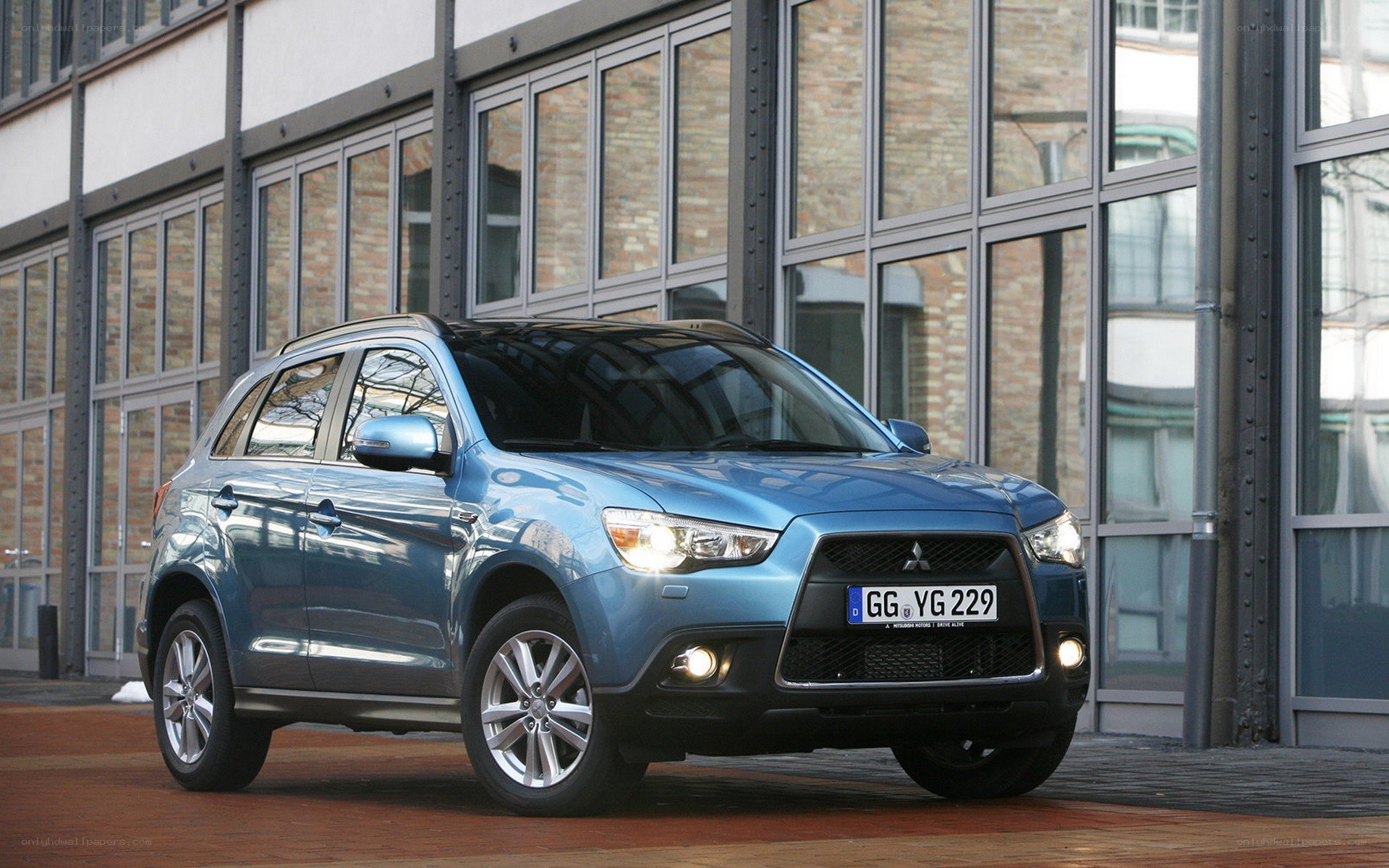 Blue Mitsubishi SUV parked