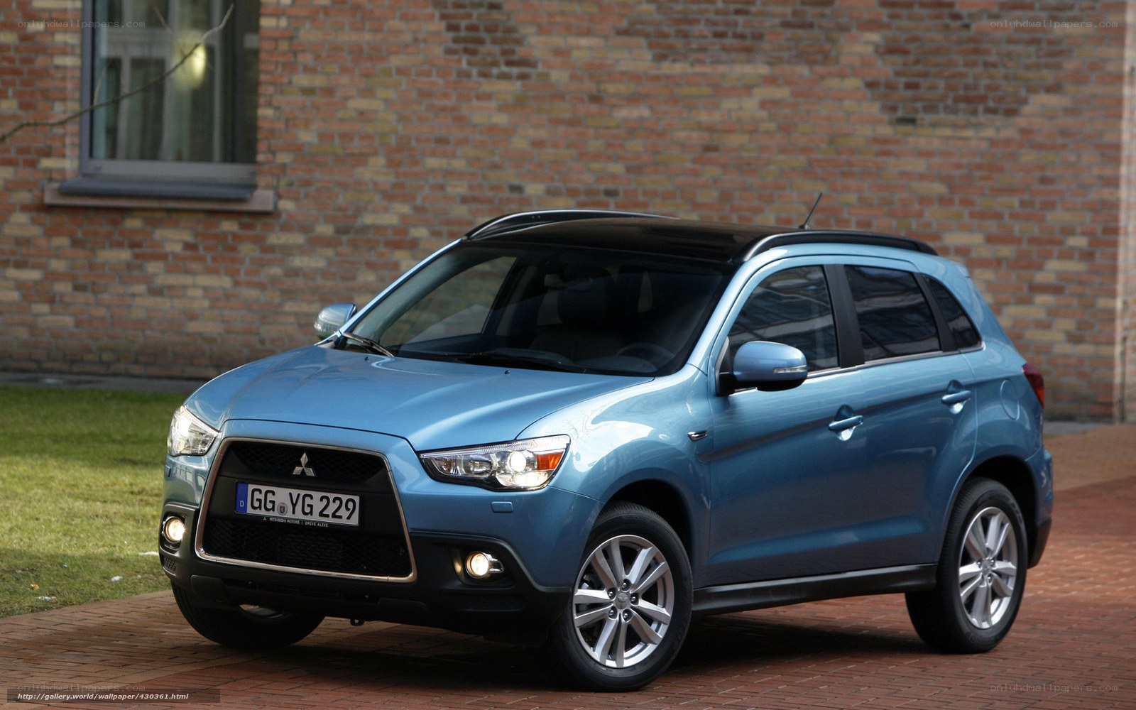 blue mitsubishi suv parked