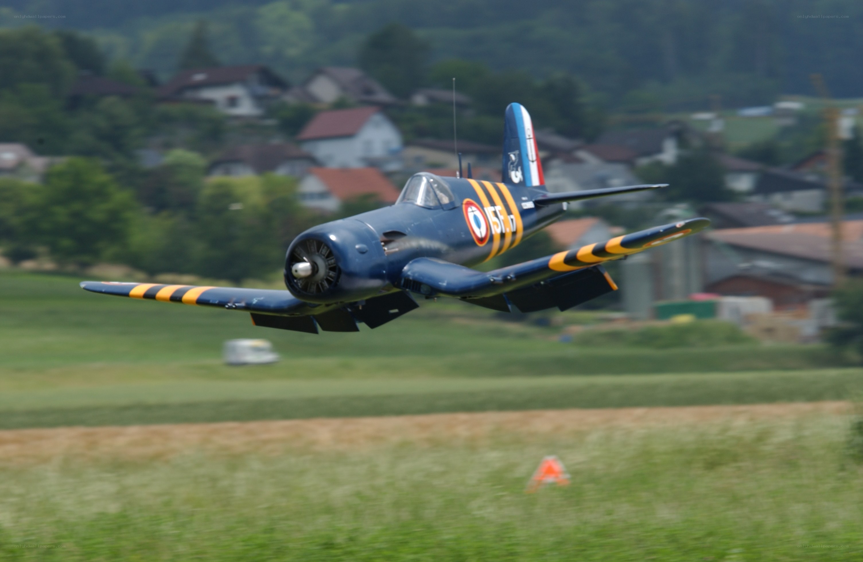 blue model airplane in flight