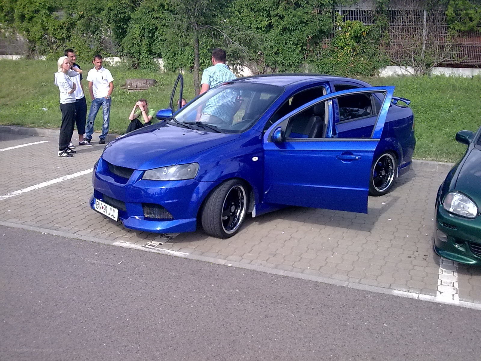 Blue modified car at a meet