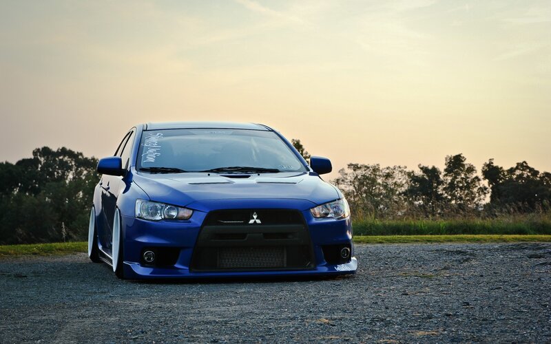 Blue Modified Car — Calm, Sunset