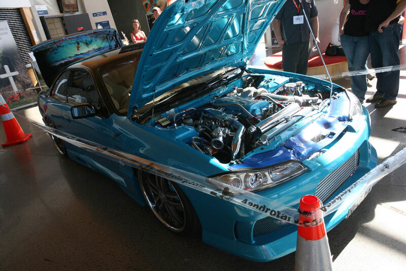 blue modified car on display