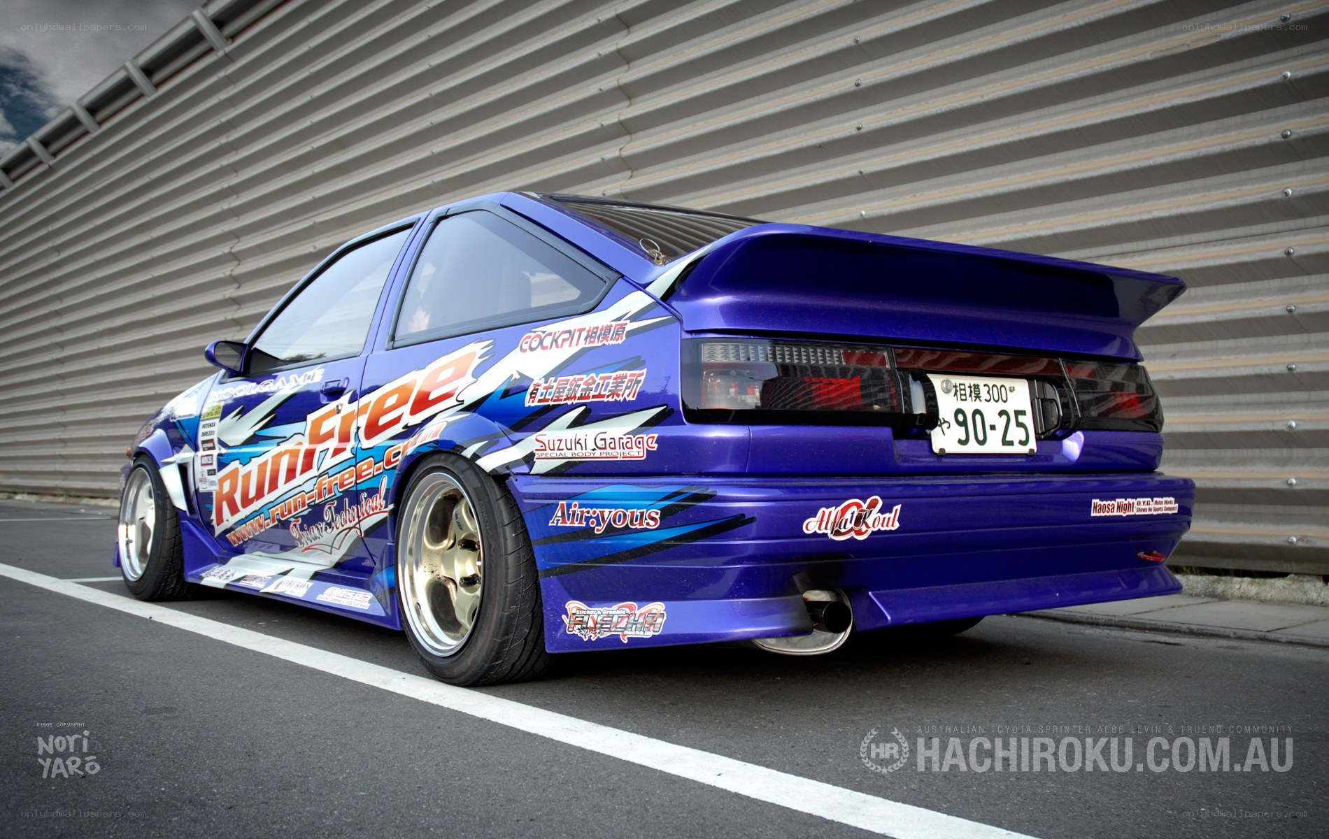 blue modified car with decals