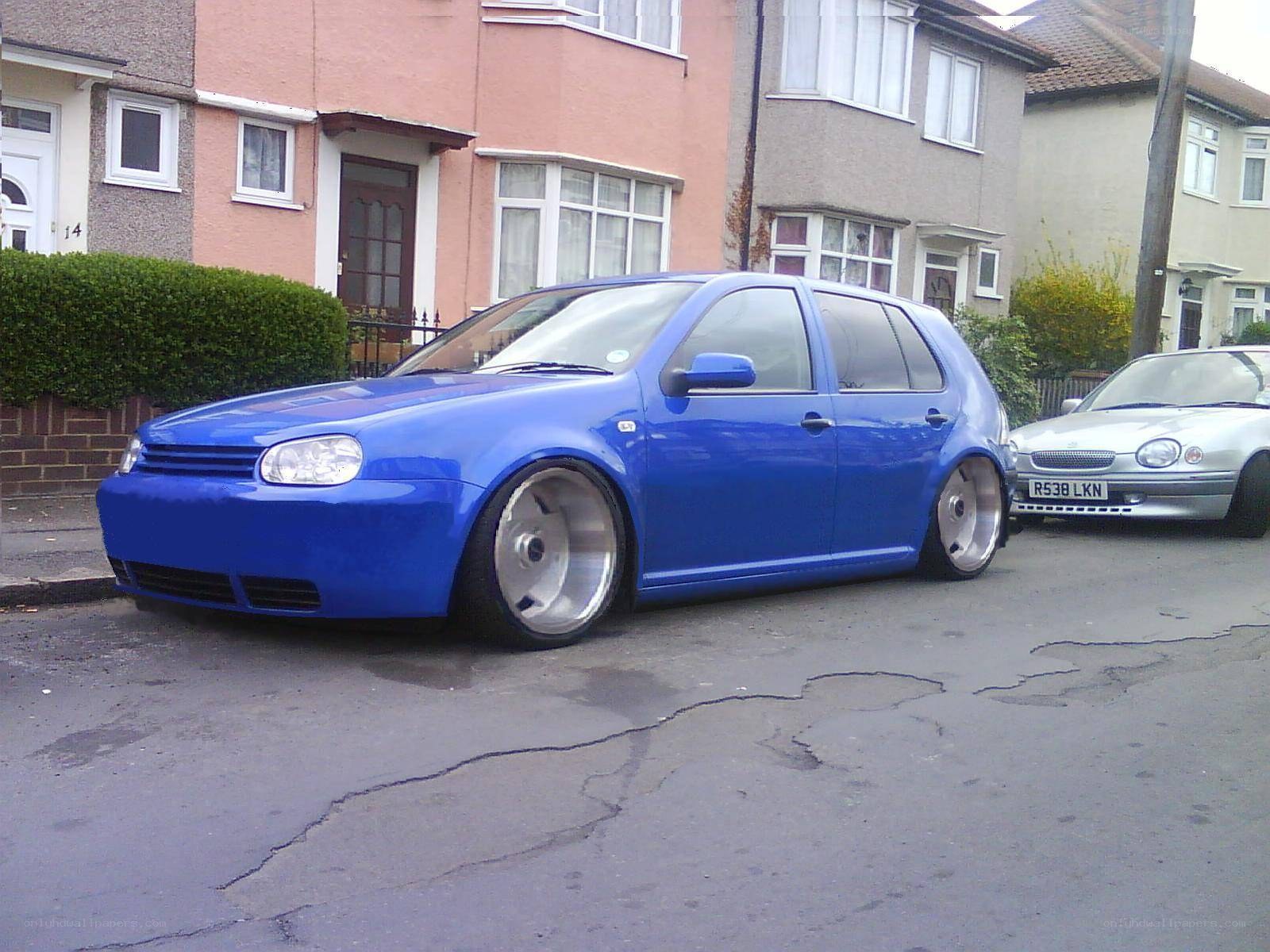 blue modified golf on street