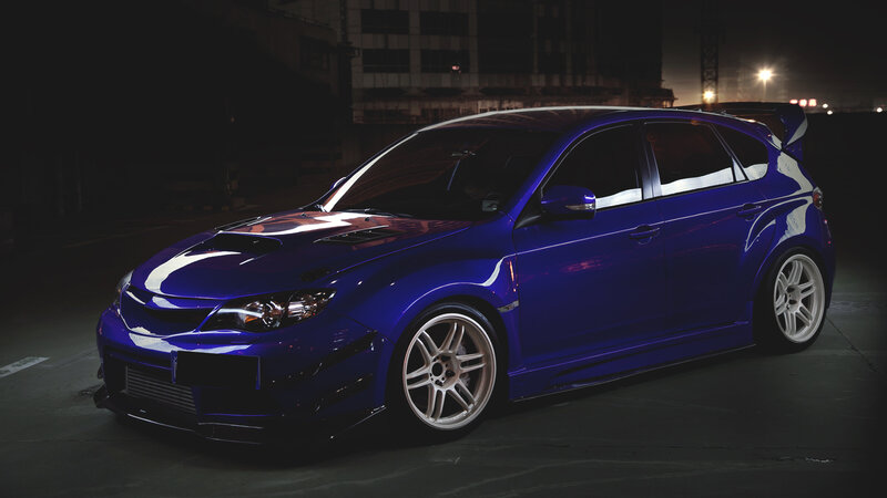 Blue Modified Hatchback — Dramatic, Night