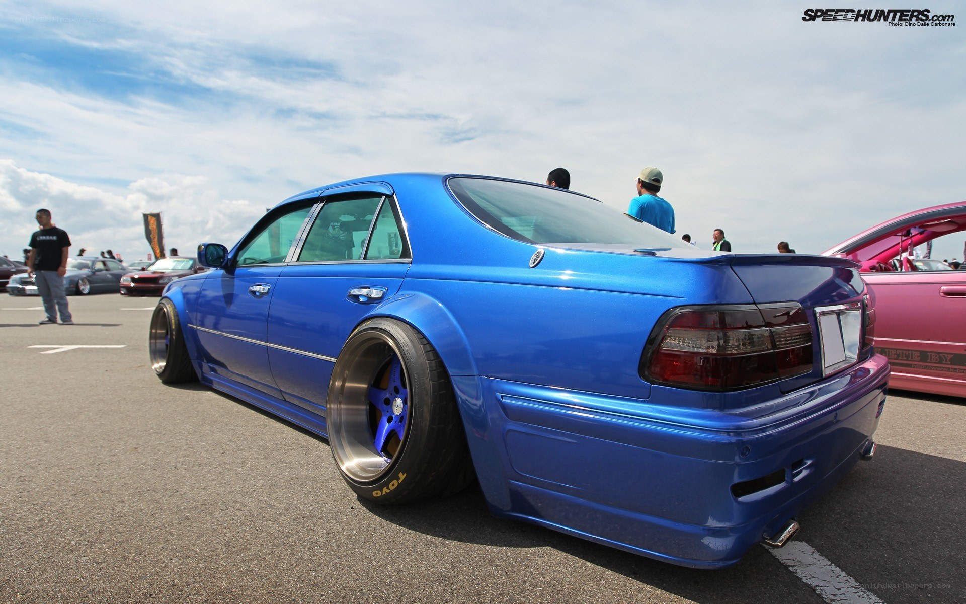 Blue modified sedan at car show
