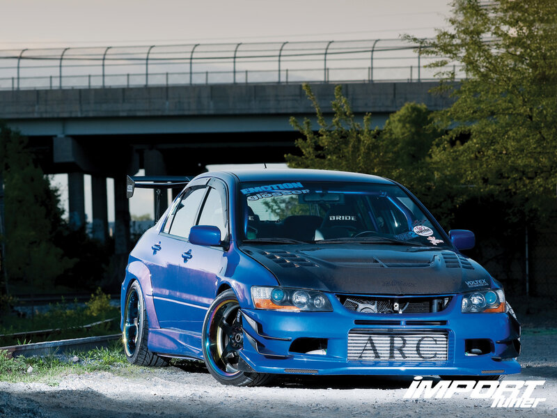Blue Modified Sedan — Dramatic, Sunset