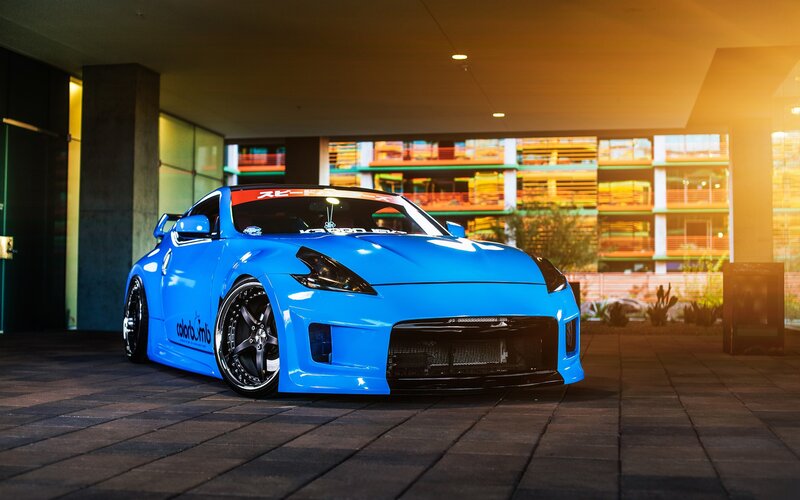 Blue Modified Sports Car — Dramatic, Night, Photograph, Building
