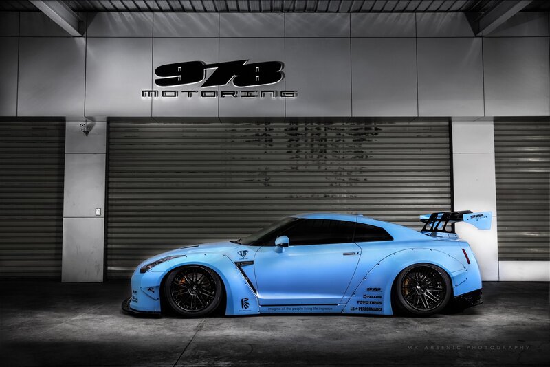 Blue Modified Sports Car — Dramatic, Photograph, Garage Door