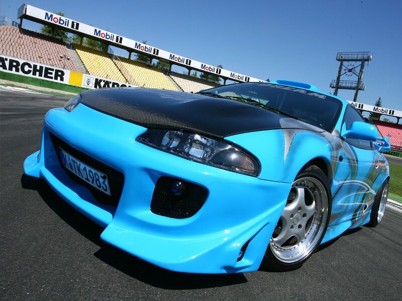 blue modified sports car on track
