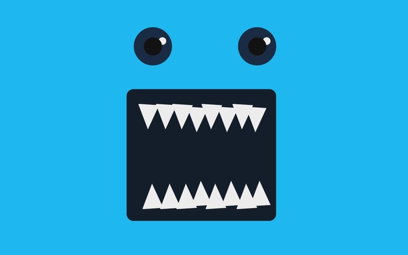 blue monster face with sharp teeth