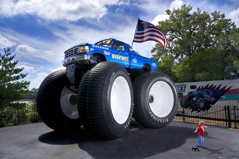 Blue monster truck with American flag