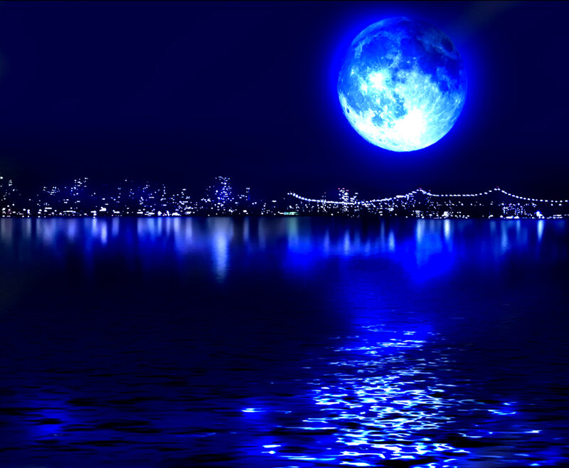 Blue moon over city skyline