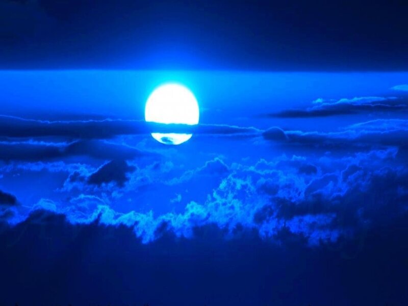 Blue Moon over Clouds — Dramatic