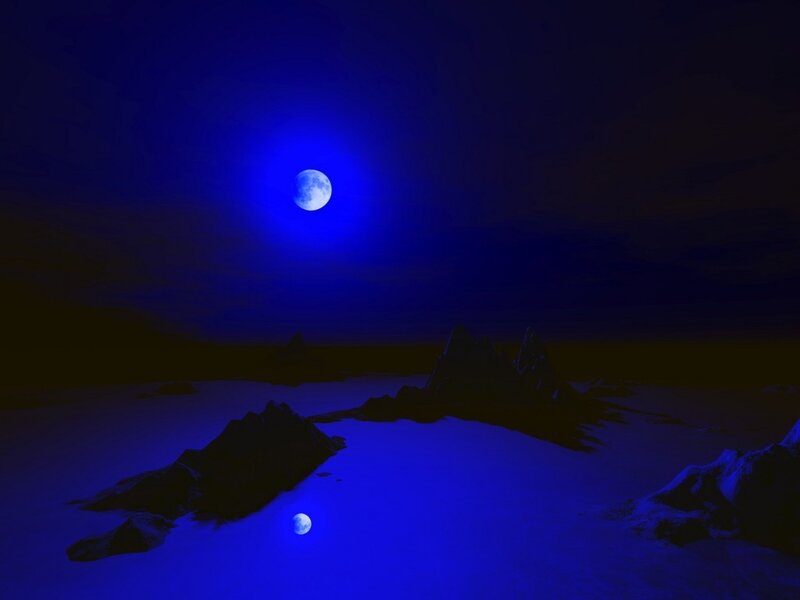 Blue moon over icy landscape
