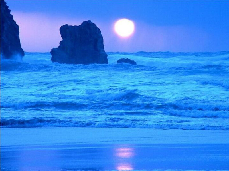 Blue Moon Over Ocean Waves