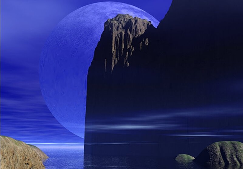 Blue moon over rocky coast