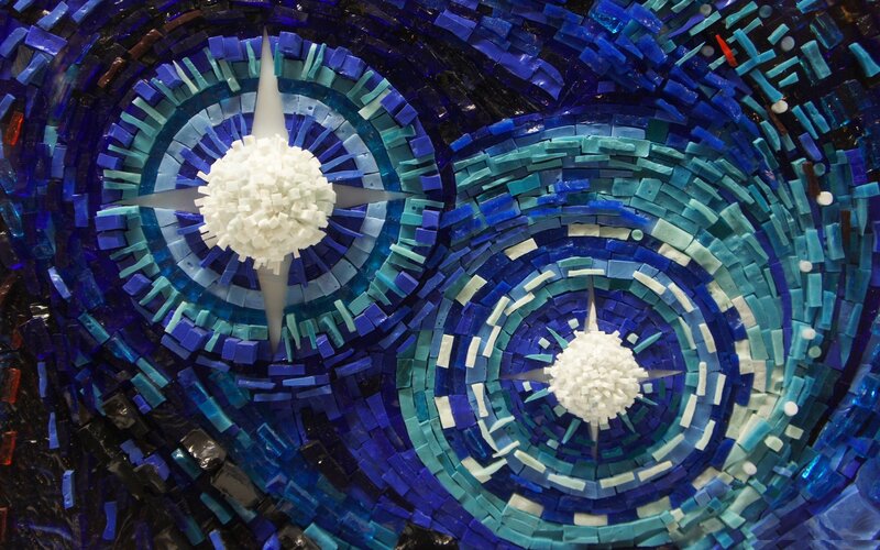 Blue mosaic art with star patterns