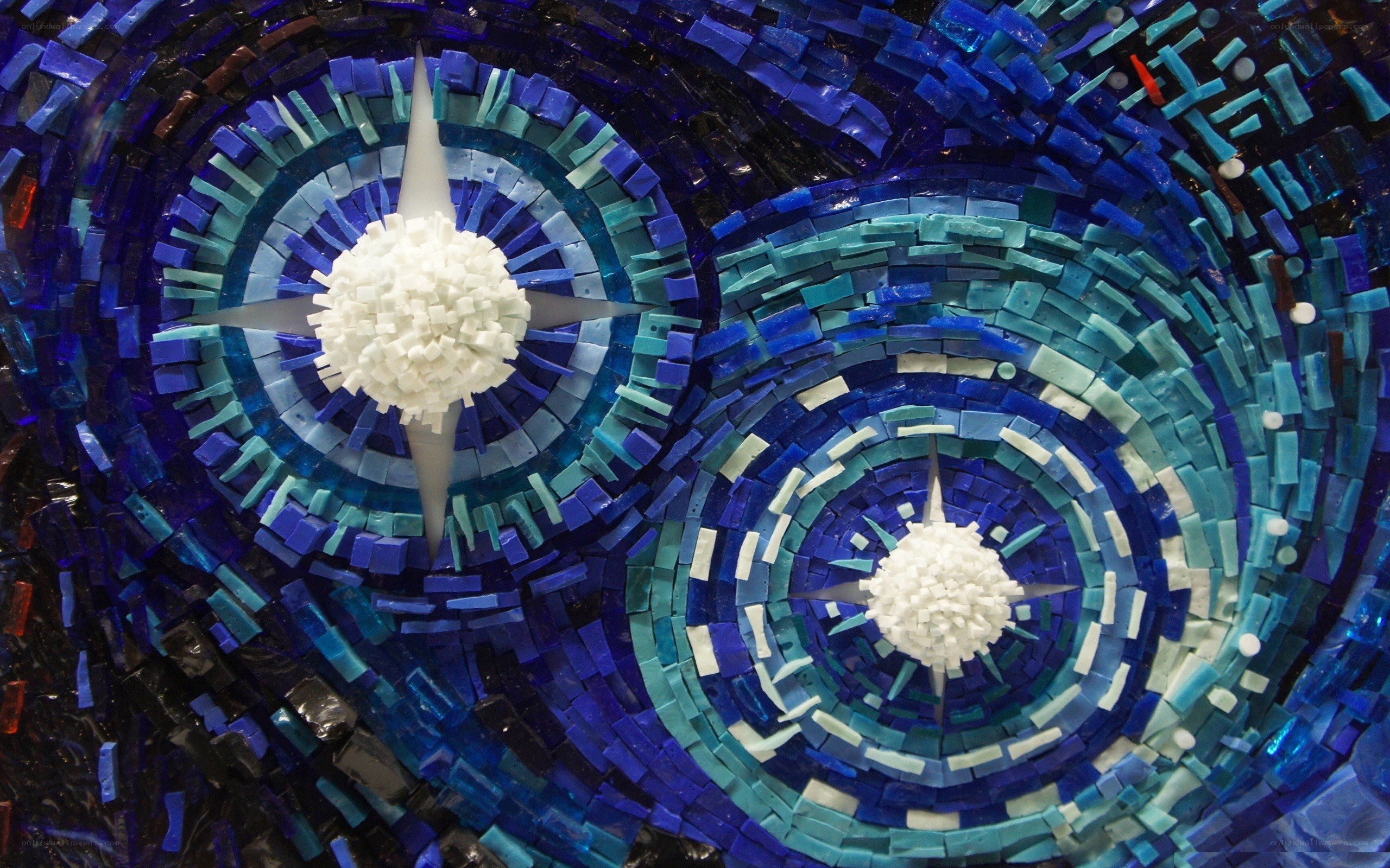 Blue mosaic art with star patterns