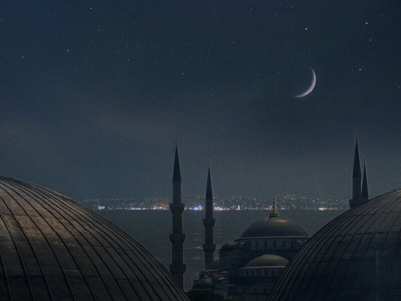 Blue Mosque at night with crescent moon