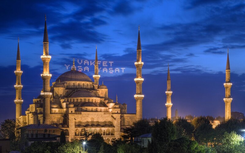 Blue Mosque at night with message