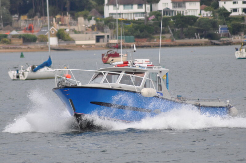 Blue Motorboat in Water