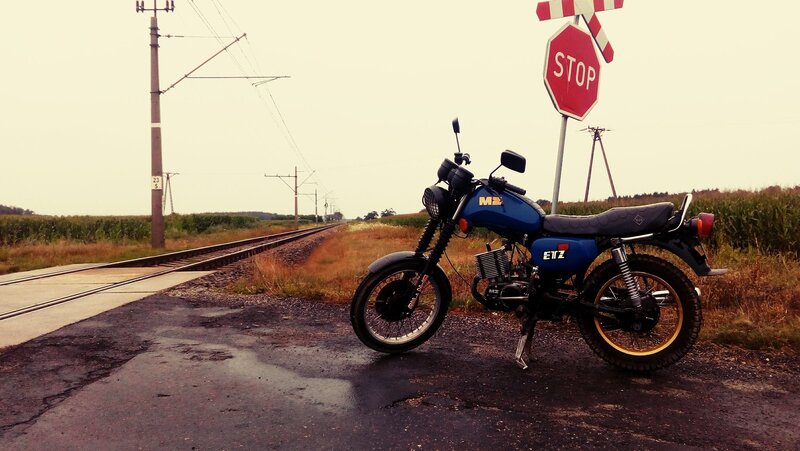 Blue Motorcycle at Crossing