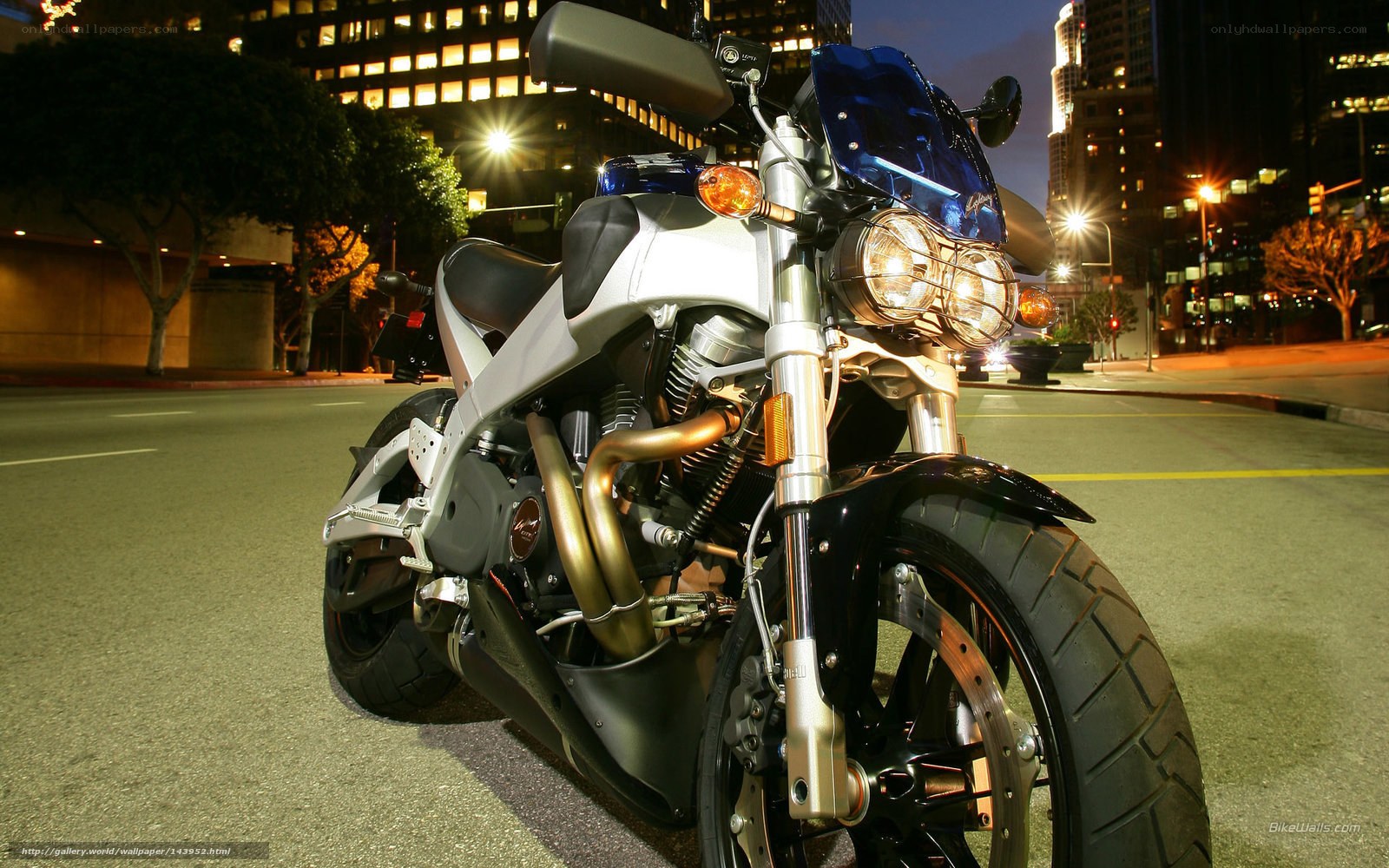 Blue motorcycle at night in city