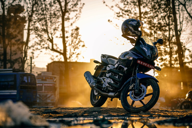 Blue Motorcycle at Sunset — Dramatic
