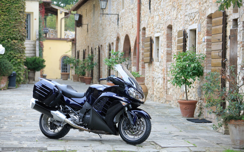 Blue motorcycle in a stone alley