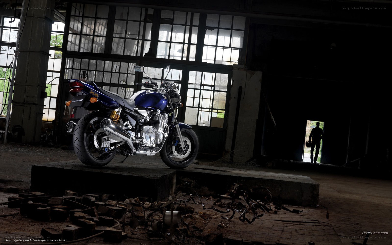 Blue motorcycle in abandoned warehouse