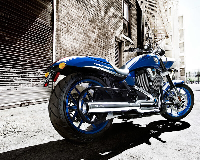 Blue motorcycle in alley