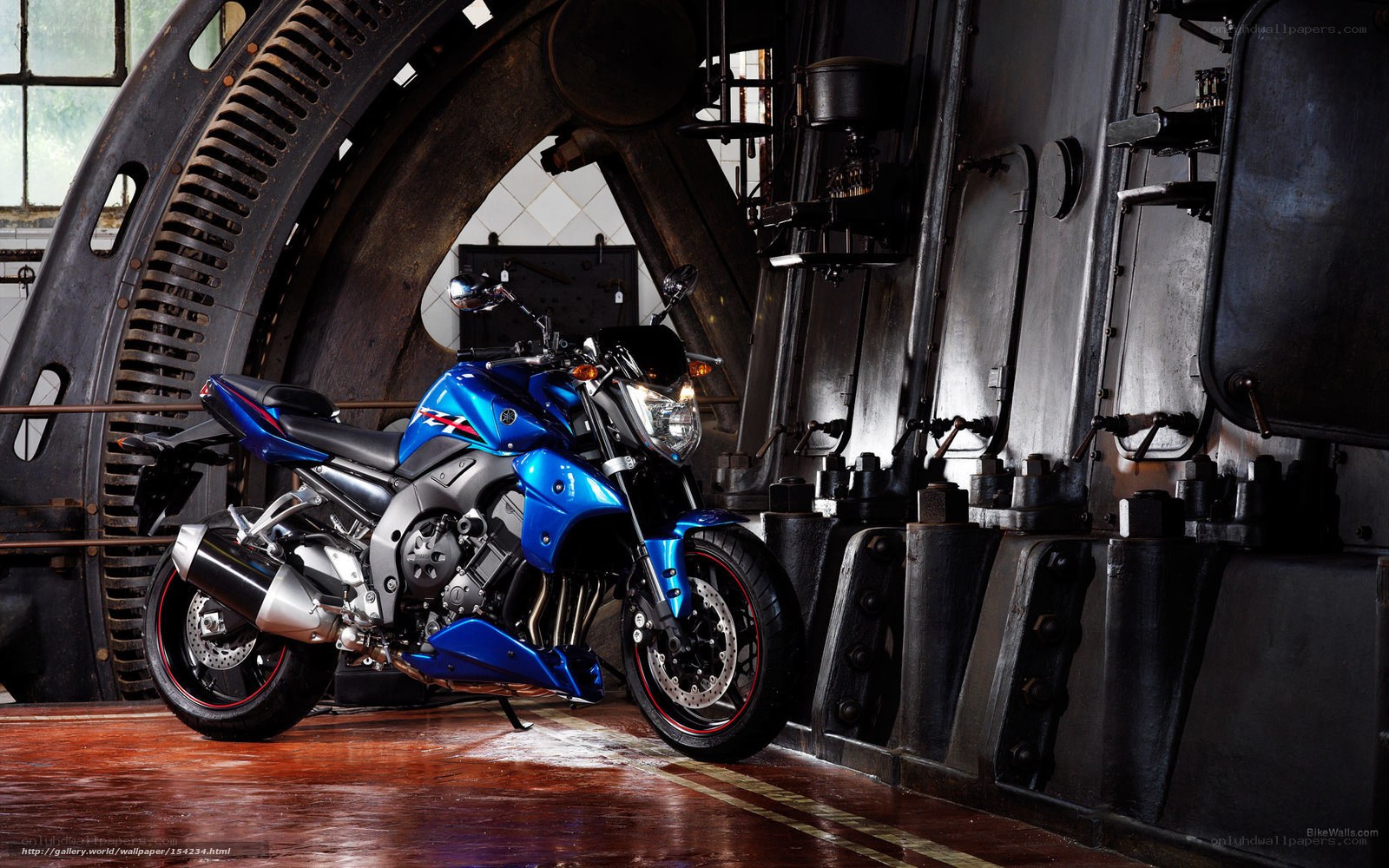 Blue motorcycle in industrial setting