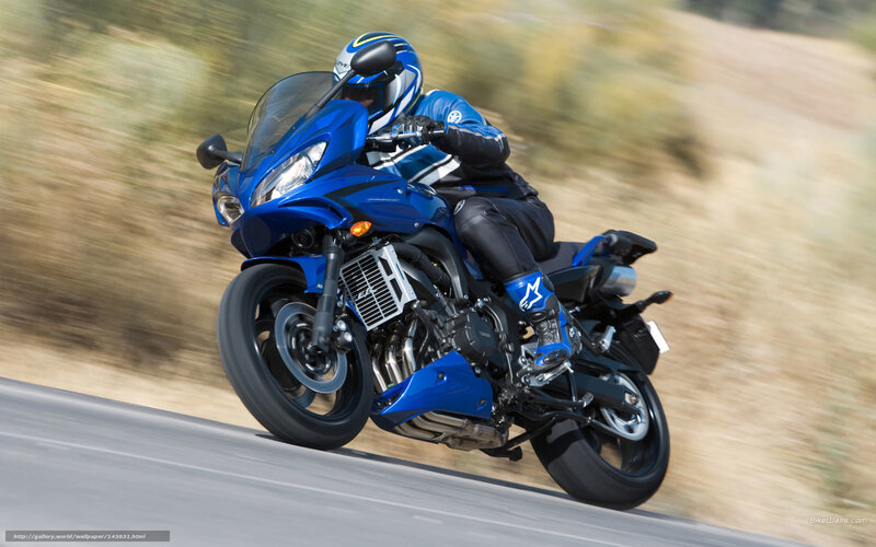 Blue motorcycle in motion