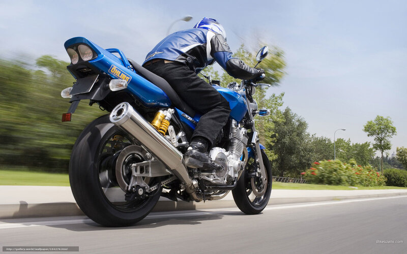 blue motorcycle in motion