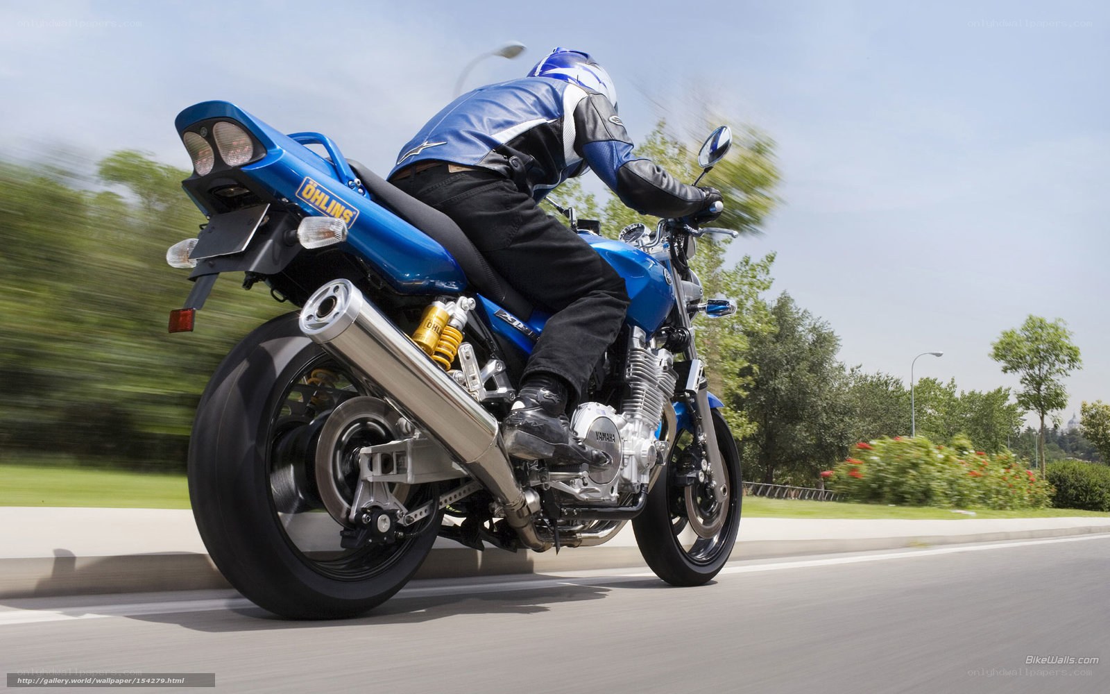 blue motorcycle in motion