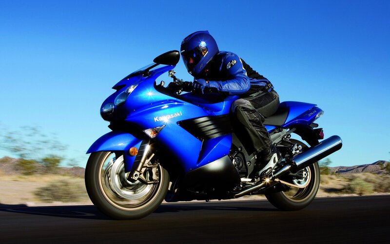 Blue motorcycle in motion