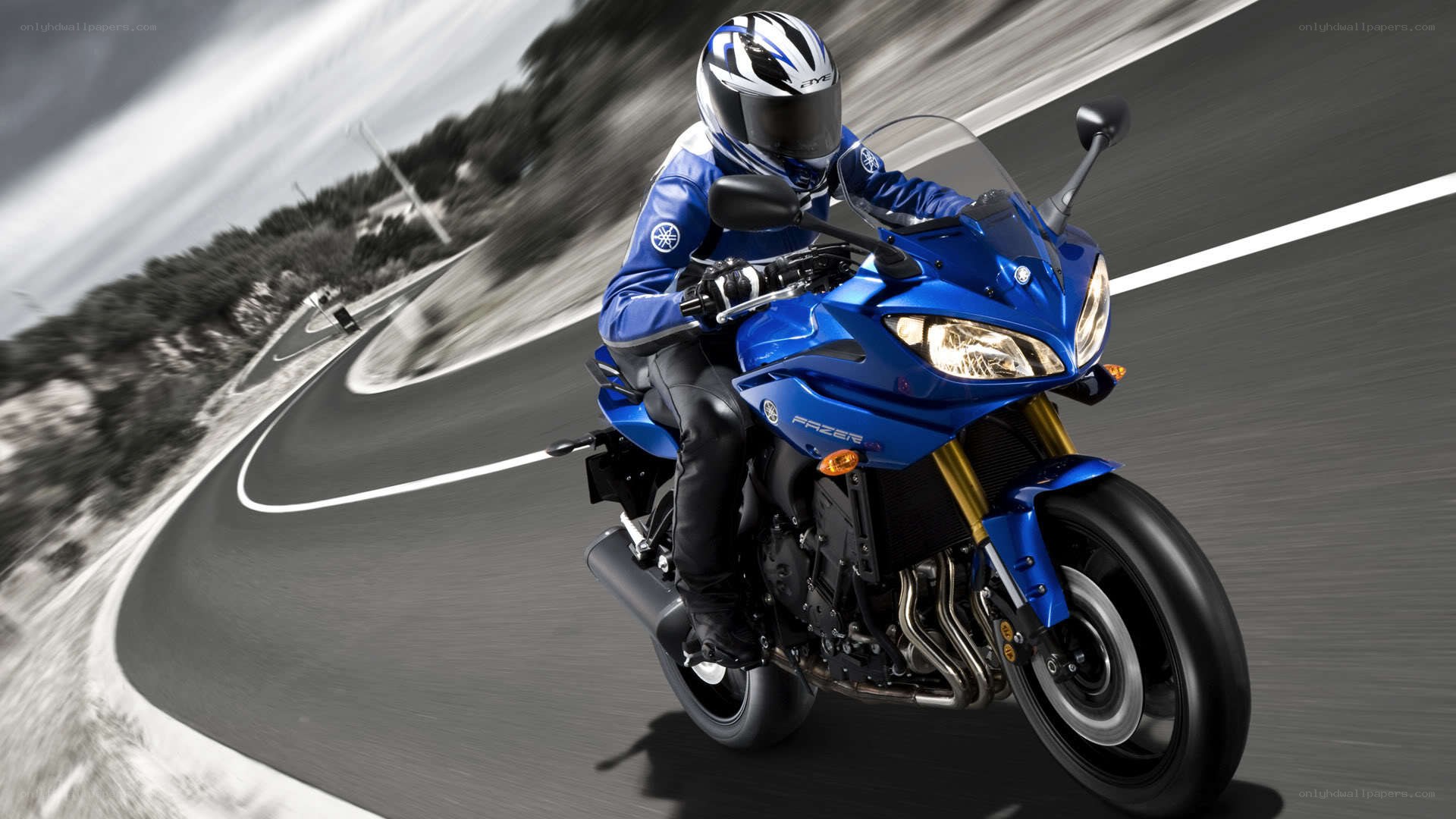 Blue motorcycle on a winding road