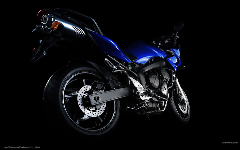 blue motorcycle on black background